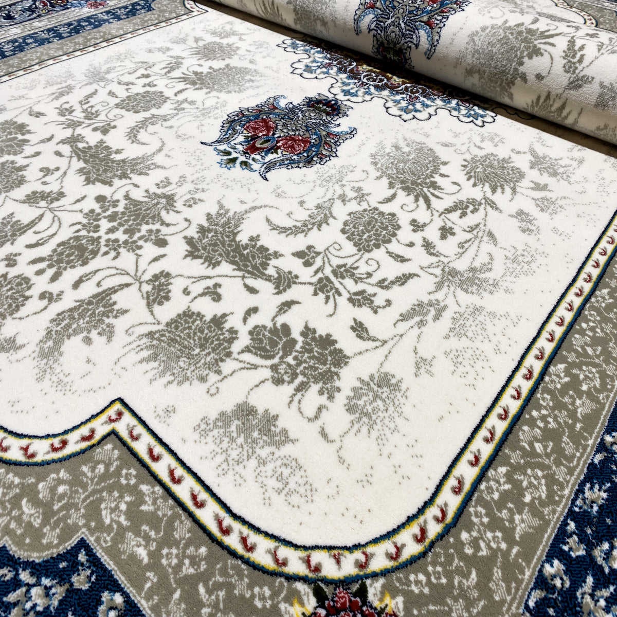 Tapis couleur crème 170x240 cm avec motif ornemental bleu et bordure