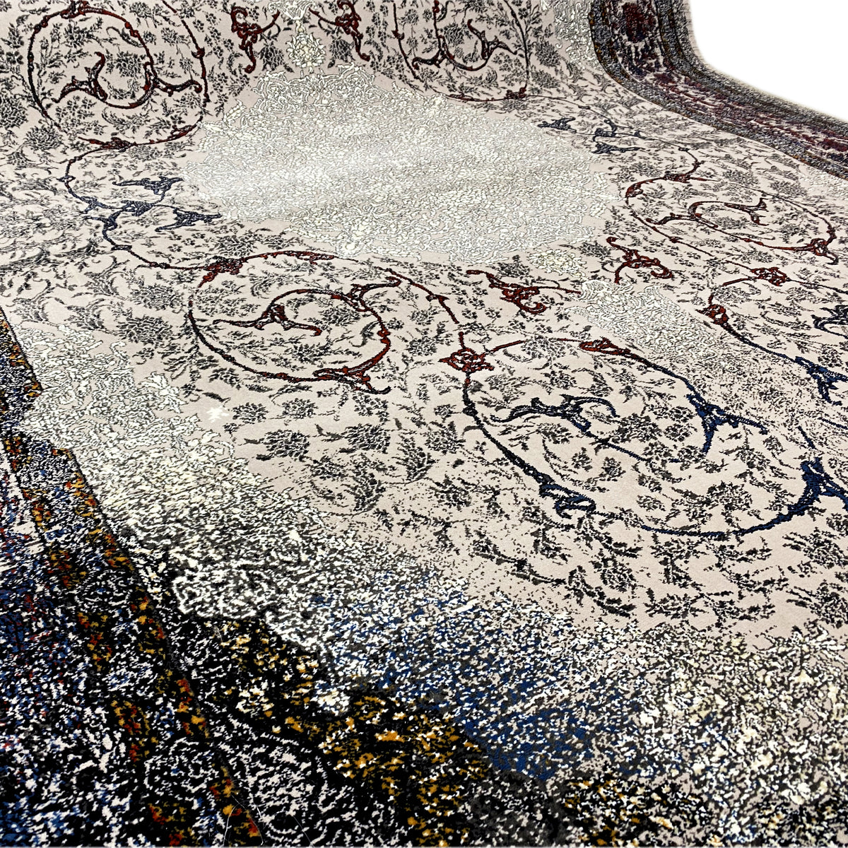 Tapis Sofia 160x230 cm, détail de la texture avec une fine brillance ; motif ornemental au centre