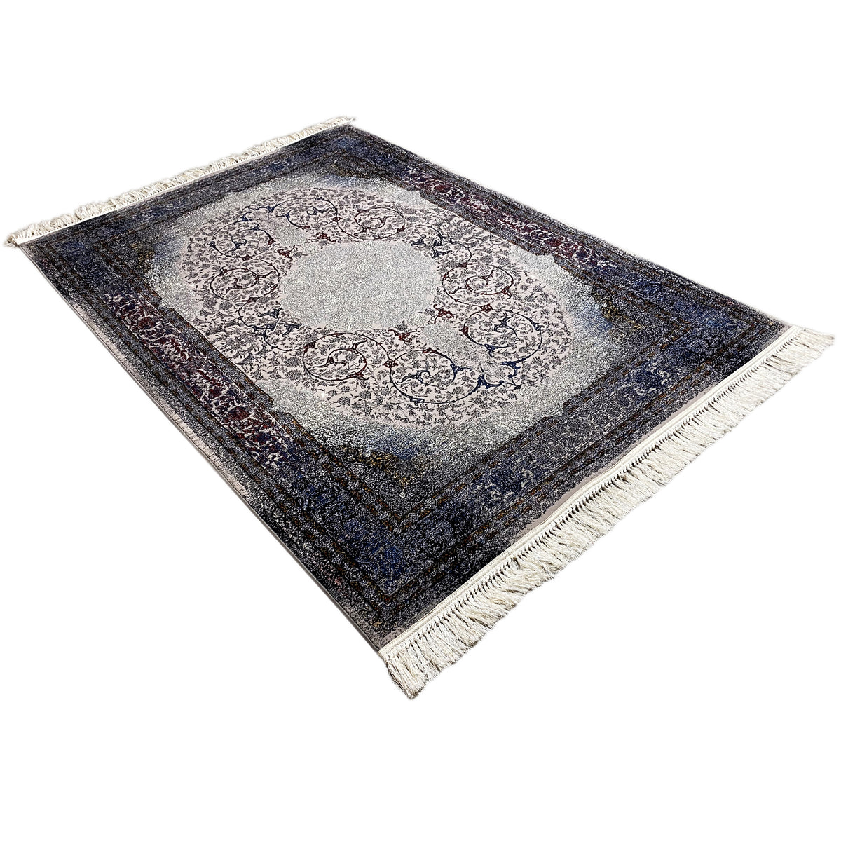 Tapis Sofia 160x230 cm, vue en biais du dessus ; médaillon, bordure bleu foncé, franges