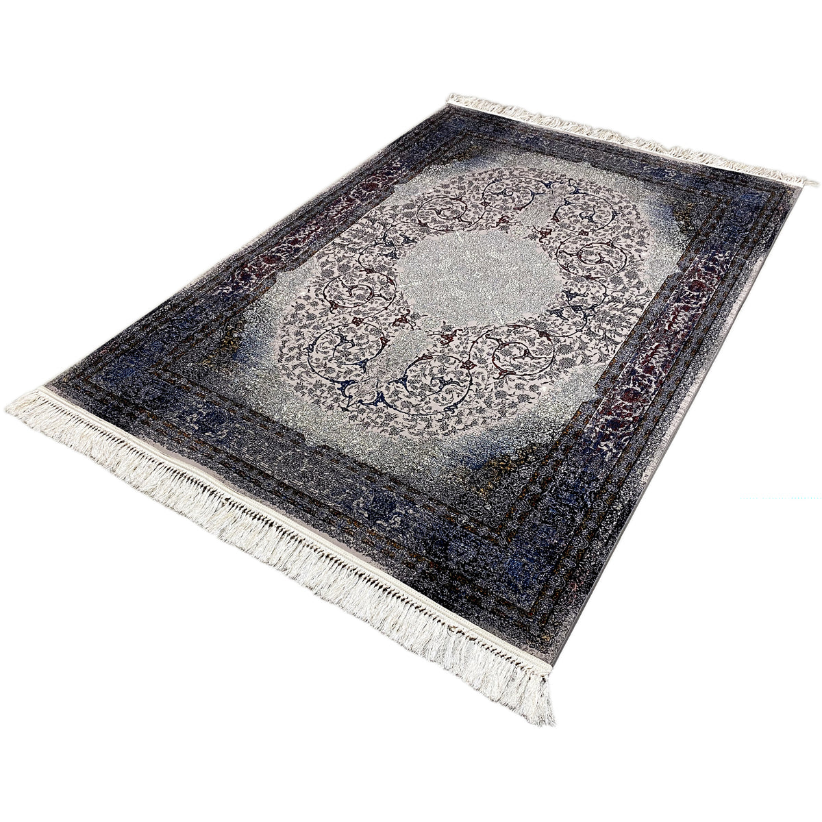 Tapis vu en biais avec médaillon gris clair, bordure sombre et longues franges