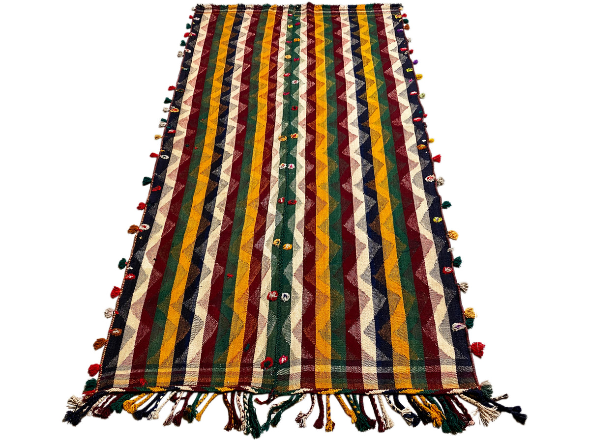 Tapis Jajim coloré avec motifs zigzag et rayures multicolores, accents verts, franges