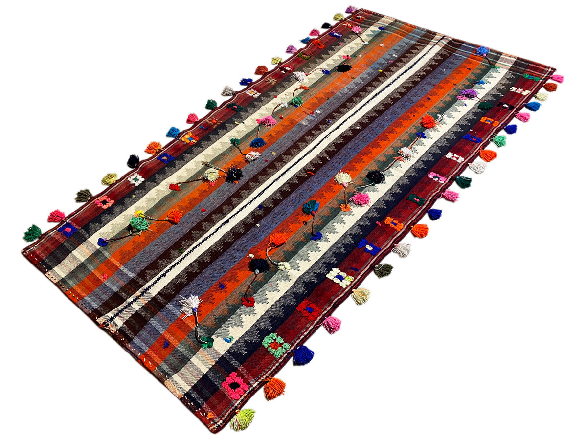 Tapis jajim incliné à motif rayé et à glands multicolores