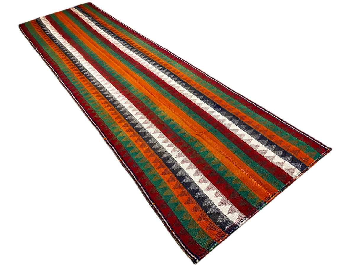 Tapis de couloir jajim en biais : rayures multicolores en zigzag, bordure gansée
