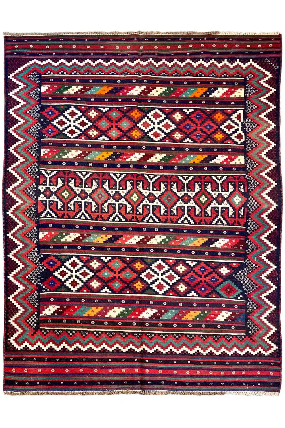 Tapis kilim complet : ornements centraux, cadre en zigzag et bandes rouges, bleues et vertes.