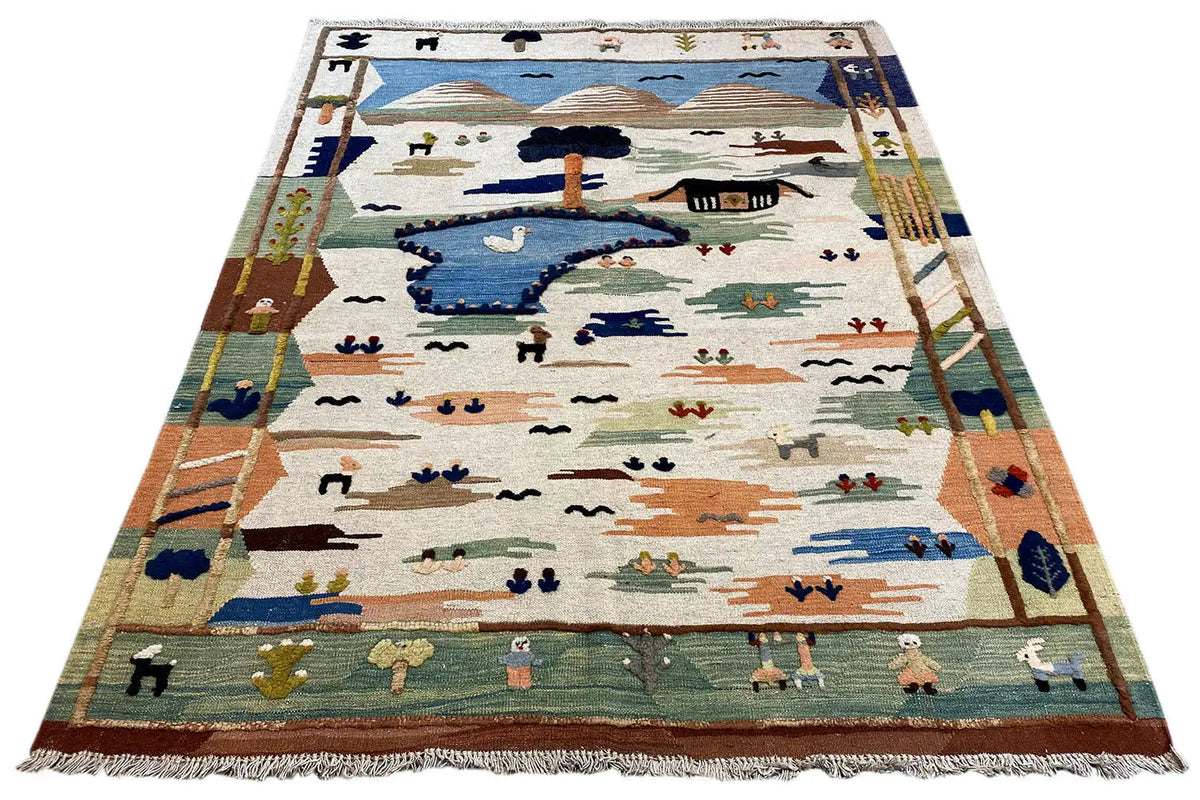 Tapis Kilim Qashqai, exemplaire présenté avec bordure colorée et franges