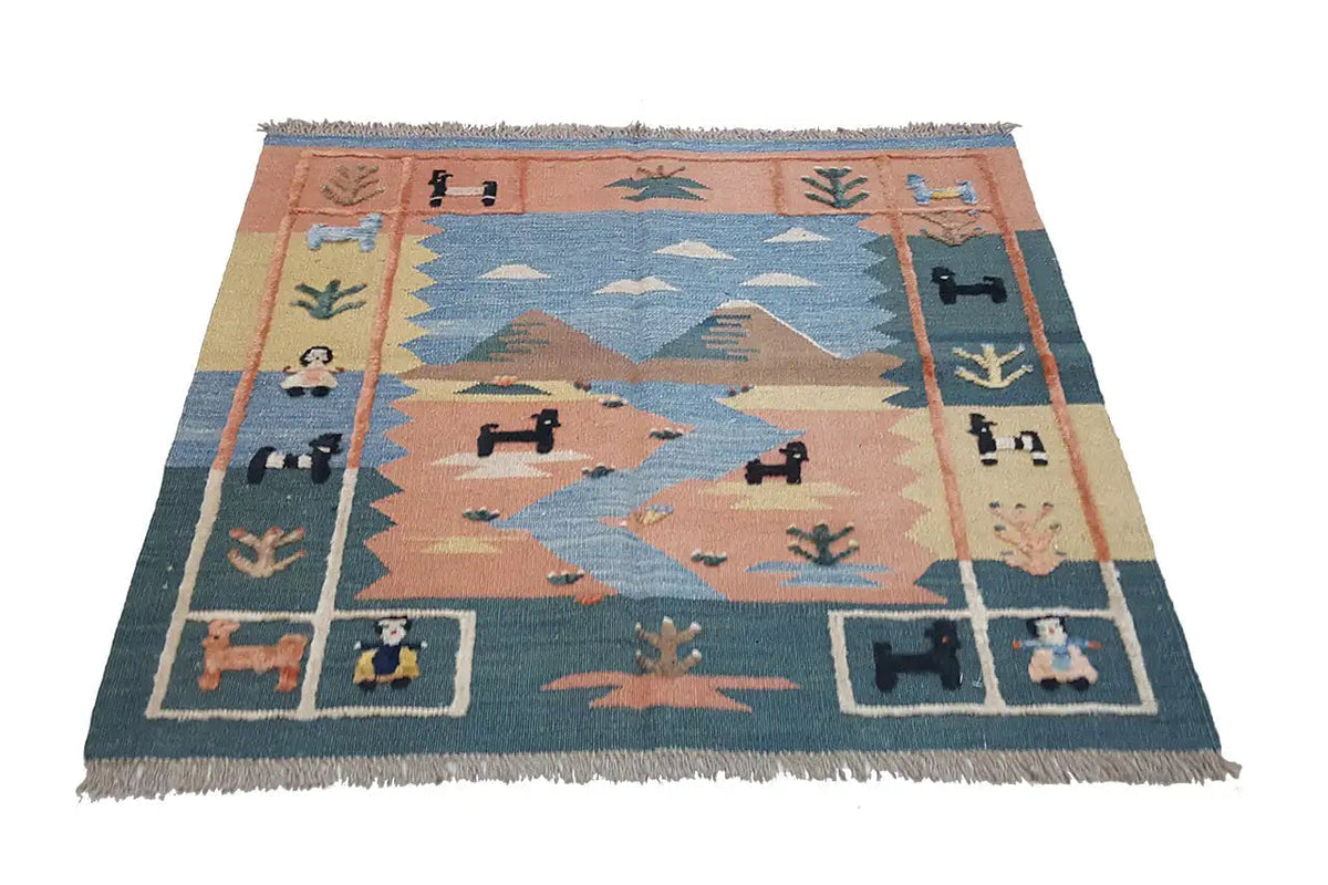Tapis kilim à motif géométrique bleu, brun et crème, avec franges