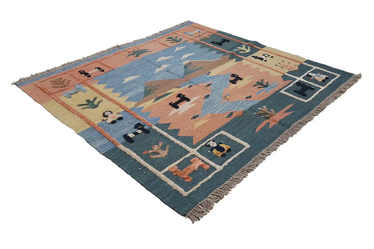 Tapis kilim à motifs géométriques marron, bleus et crème, avec bordure décorative