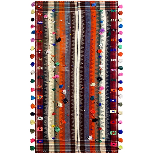 Wohnzimmer bunter Jajim Teppich handgewebt mit geometrischem Streifenmuster und Troddeln