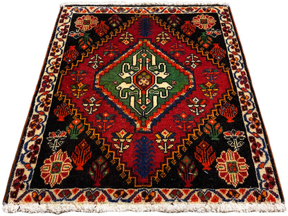 Tapis Poshti carré, fond noir avec motif central en vert, rouge et bleu