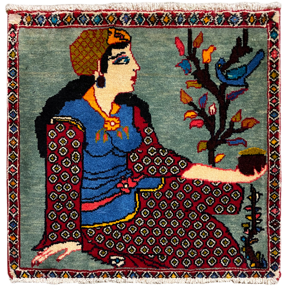 Tapis Poshti 68x63 cm avec motif figuratif et arboré, bordure multicolore et franges