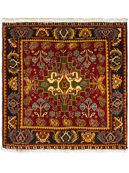 Tapis Poshti 61x61 cm avec motif multicolore et bordure à franges sur le pourtour