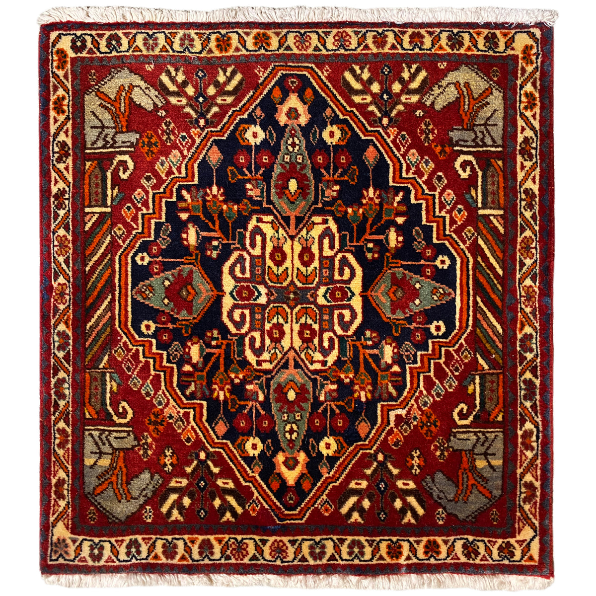 Tapis 65x59 cm avec médaillon rouge et bleu, motifs ornementaux et franges