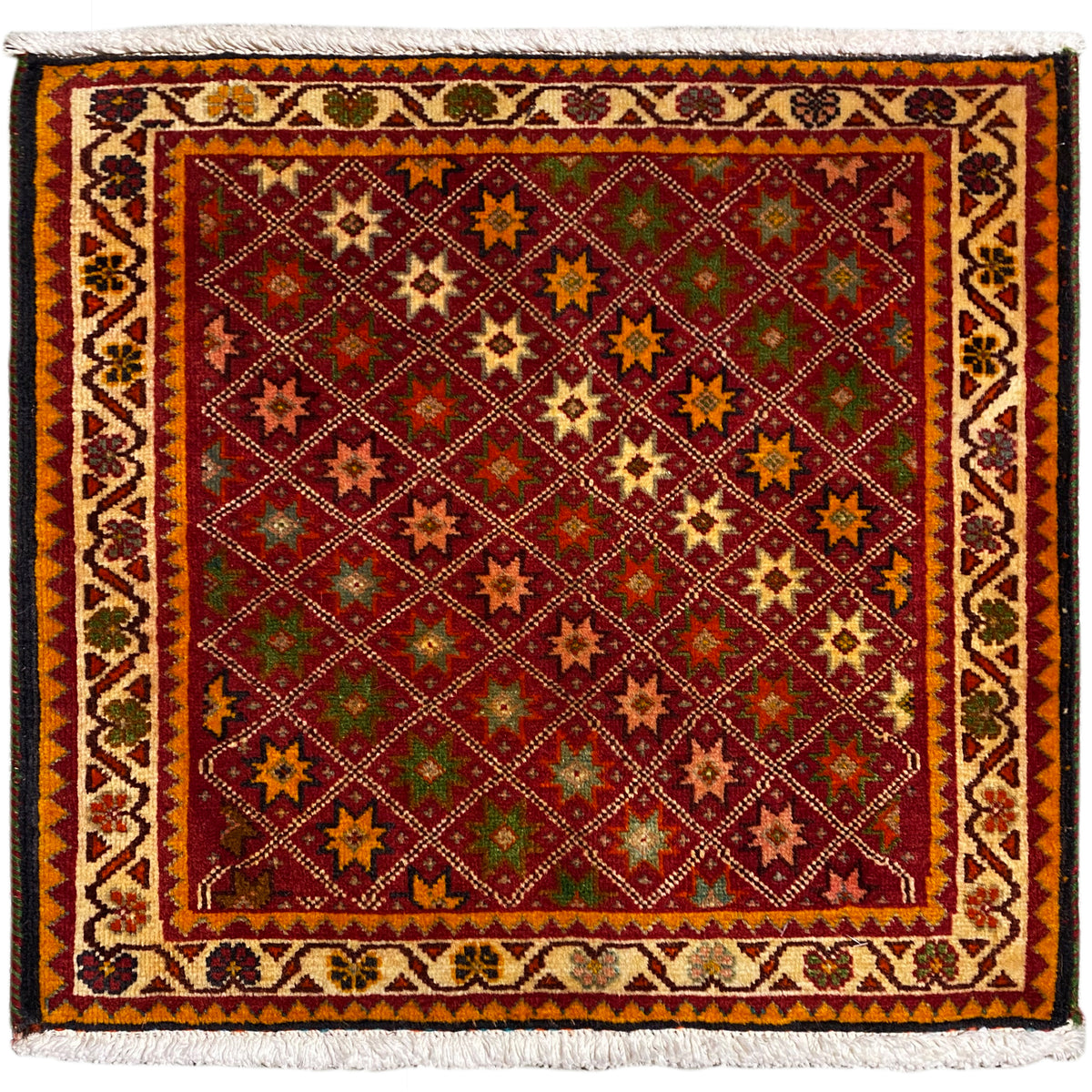 Tapis Poshti, rectangulaire, multicolore avec motifs étoilés ornementaux et bord à franges.