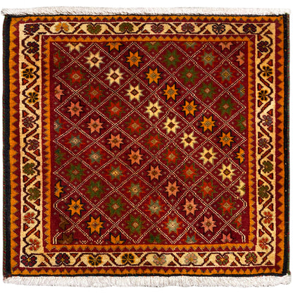 Tapis Poshti, rectangulaire, multicolore avec motifs étoilés ornementaux et bord à franges.