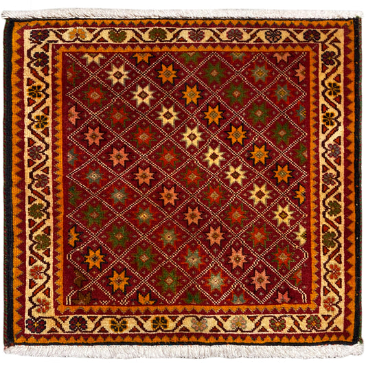 Tapis Poshti, rectangulaire, multicolore avec motifs étoilés ornementaux et bord à franges.