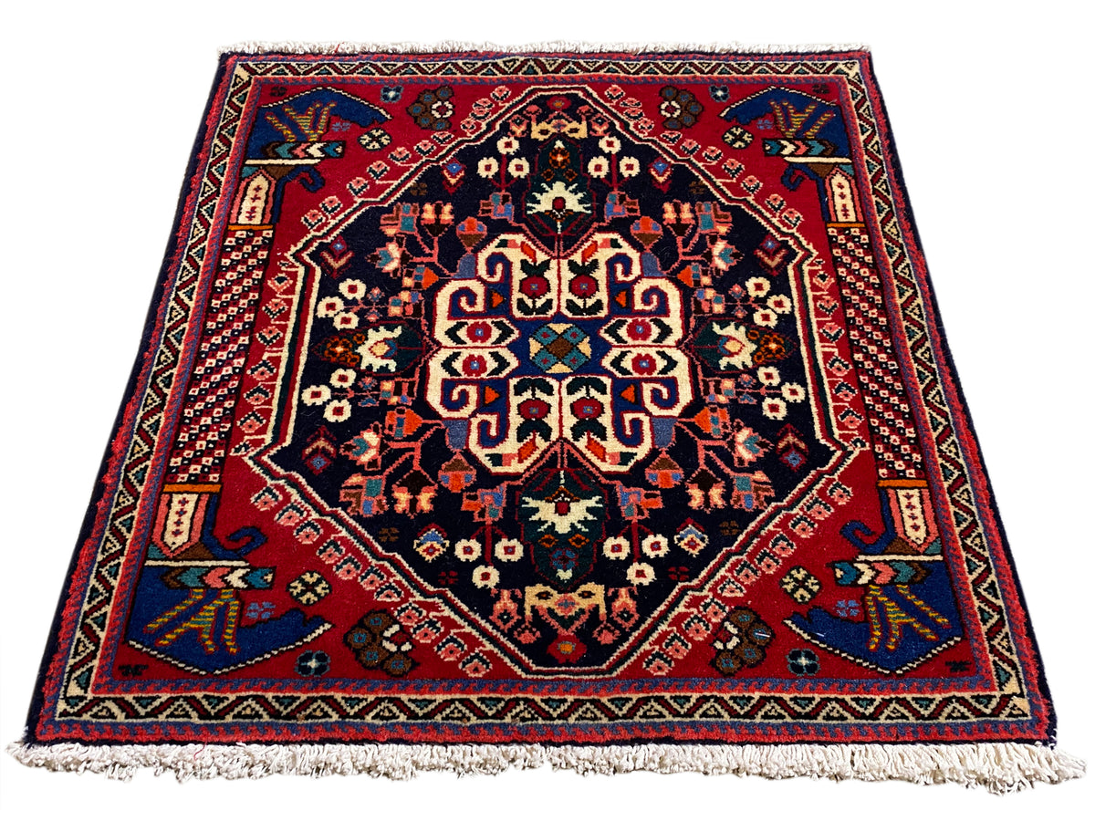 Tapis Poshti 66x63 cm, bleu foncé/rouge, motif médaillon avec franges sur le bord