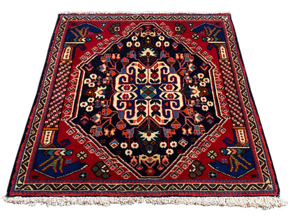 Tapis Poshti 66x63 cm, bleu foncé/rouge, motif médaillon avec franges sur le bord