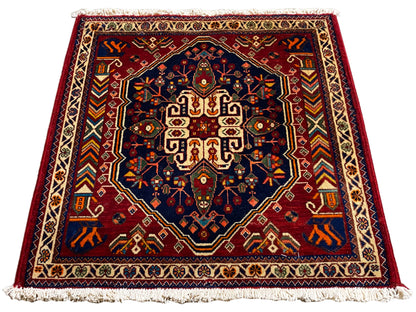 Tapis 63x60 cm, rectangulaire, centre bleu foncé avec bordure ornementale colorée