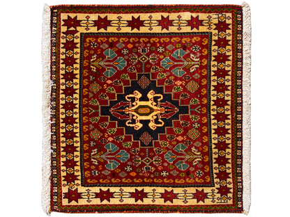 Tapis 60x58 cm : motif rouge, centre noir, bord coloré, franges