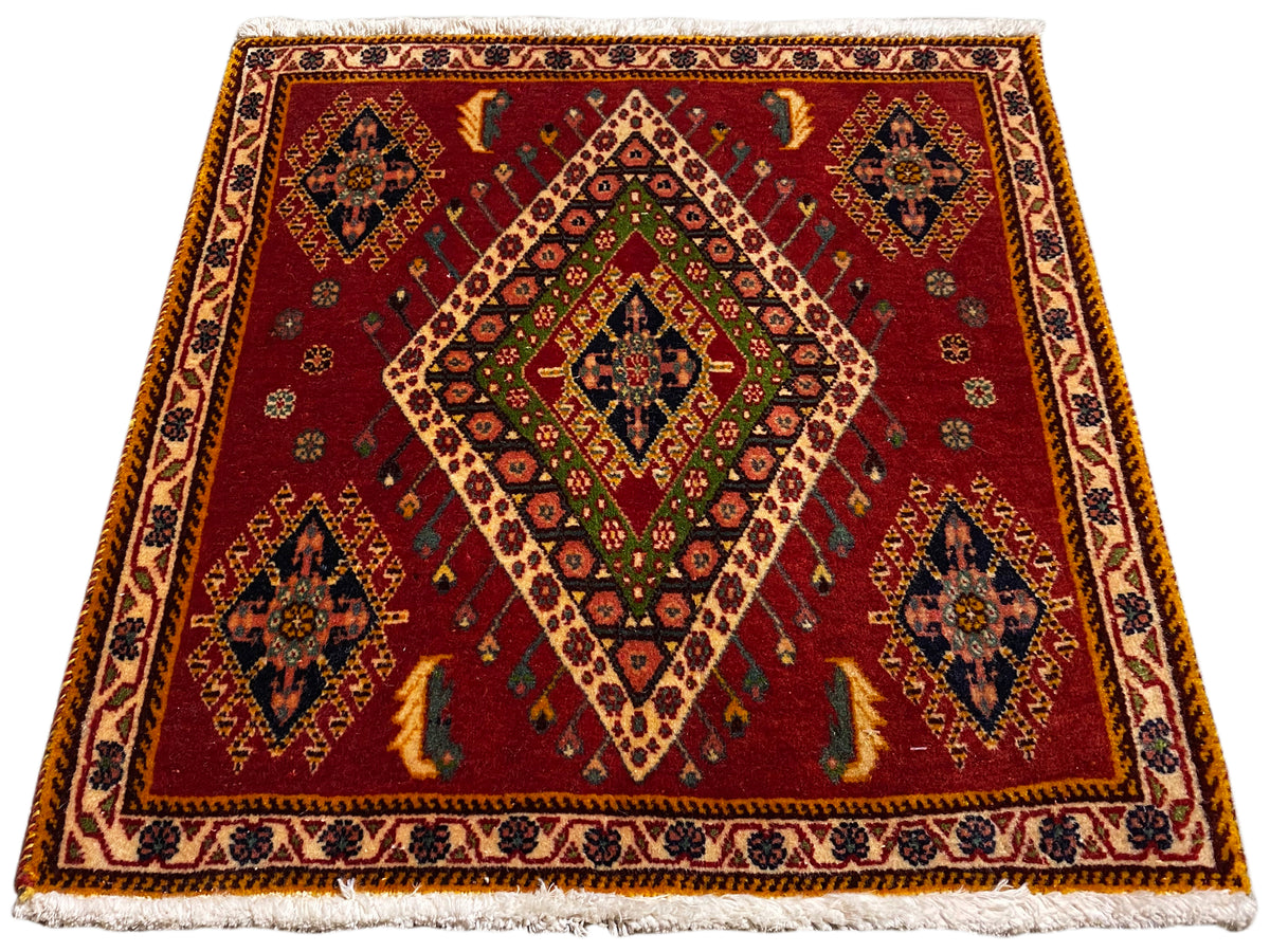 Tapis Poshti à tissage plat rouge et motif en losanges, encadré de bordures