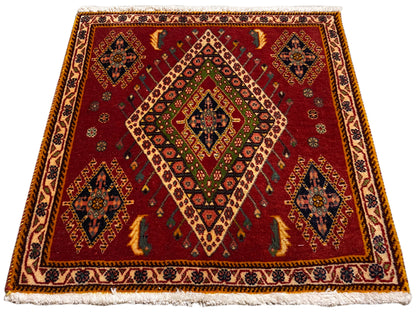 Tapis Poshti à tissage plat rouge et motif en losanges, encadré de bordures