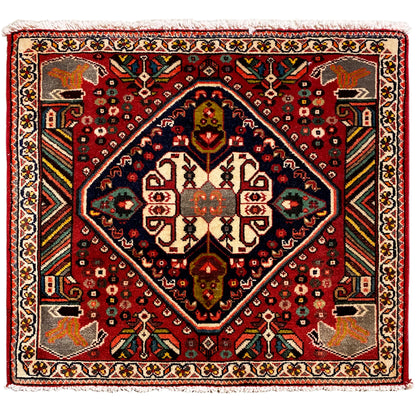 Tapis oriental avec bordure et motifs rouges, médaillon central