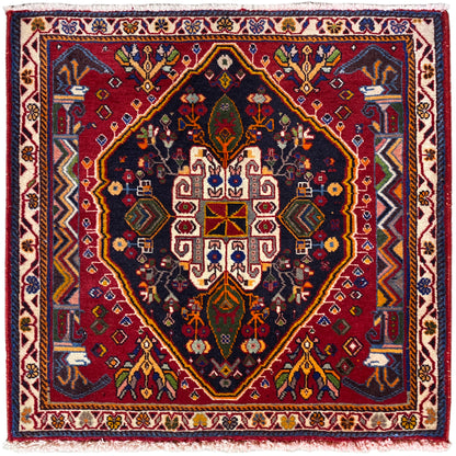 Tapis Poshti (67×67 cm) sur fond sombre, avec bordure et médaillon géométrique