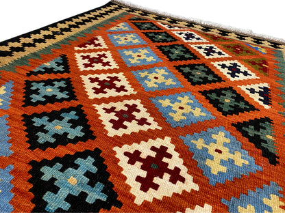 Qashqai Kelim Wollteppich orange geometrisches Muster mit dunkler Bordüre